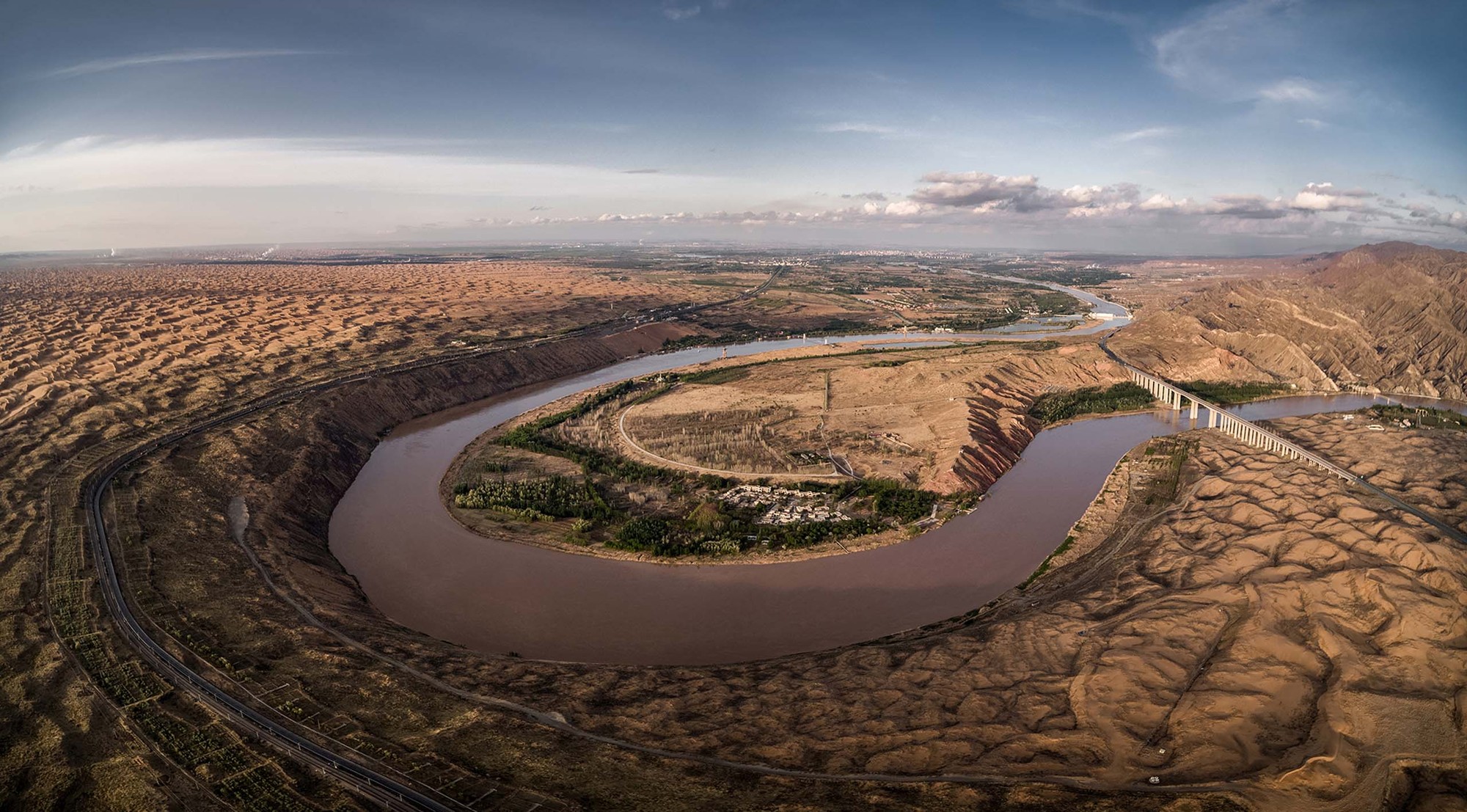 The Yellow River carving a broad bend through the landscape near Zhongwei